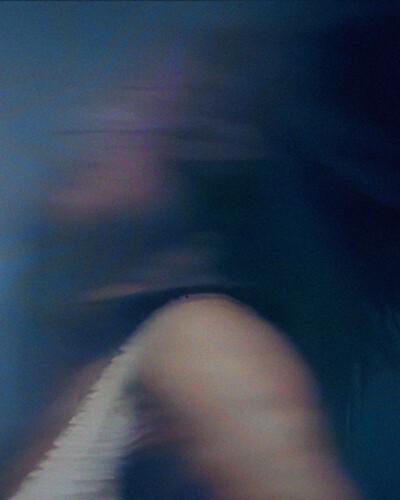 a woman in movement on a blue background